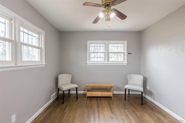 1345 Laredo St, Aurora, CO 80011 - living area with a wealth of natural light, visible vents, wood finished floors, and baseboards