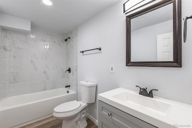 1345 Laredo St, Aurora, CO 80011 - full bath with vanity, bathing tub / shower combination, toilet, and wood finished floors