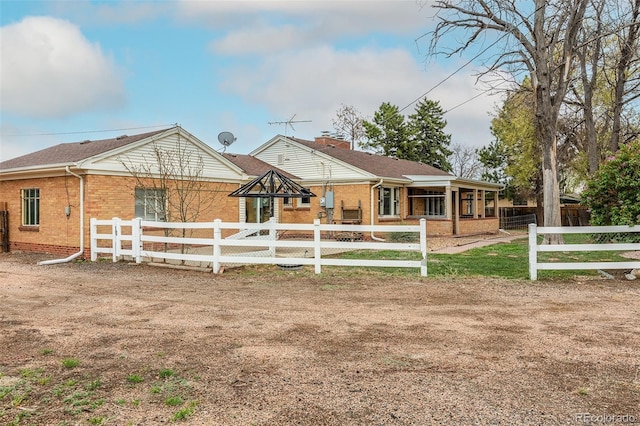 1345 Laredo St, Aurora, CO 80011 - view of front of home featuring a fenced front yard and brick siding