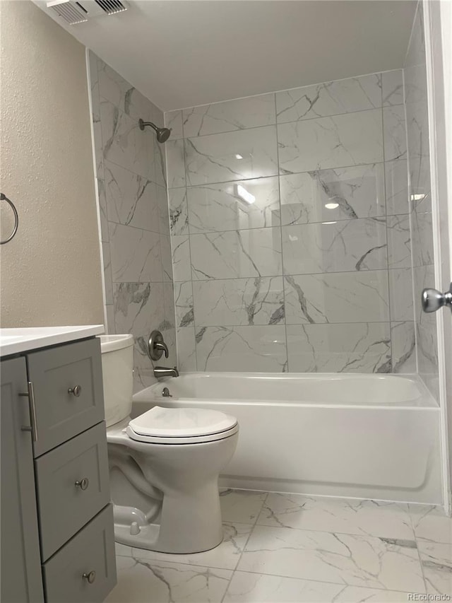 full bath featuring a textured wall, washtub / shower combination, toilet, marble finish floor, and visible vents