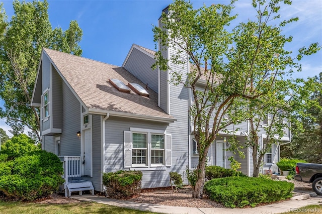 3912 S Richfield Way, Aurora, CO 80013 - view of front of property with a shingled roof and a chimney