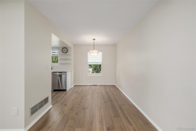 3912 S Richfield Way, Aurora, CO 80013 - unfurnished dining area with wood finished floors and baseboards