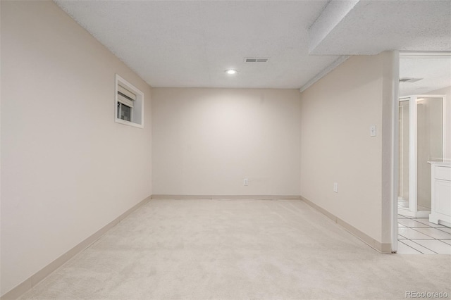 3912 S Richfield Way, Aurora, CO 80013 - empty room with light carpet, recessed lighting, a textured ceiling, and baseboards