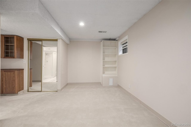 3912 S Richfield Way, Aurora, CO 80013 - basement with light colored carpet, baseboards, and recessed lighting