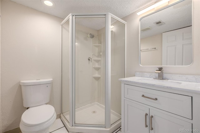3912 S Richfield Way, Aurora, CO 80013 - full bath with a shower stall, toilet, vanity, and a textured ceiling