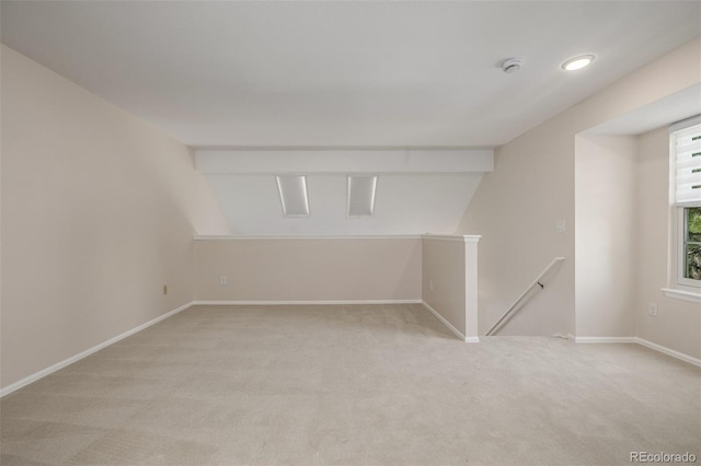 3912 S Richfield Way, Aurora, CO 80013 - below grade area featuring light colored carpet, baseboards, and recessed lighting