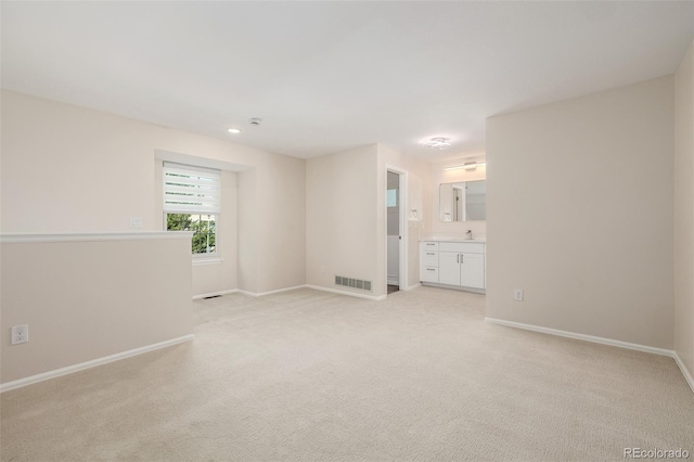 3912 S Richfield Way, Aurora, CO 80013 - unfurnished room featuring a sink, light colored carpet, baseboards, and recessed lighting
