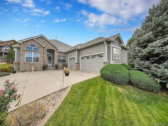 ranch-style home featuring a front lawn and a garage