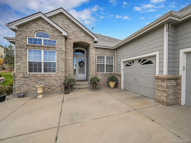 view of front of property with a garage