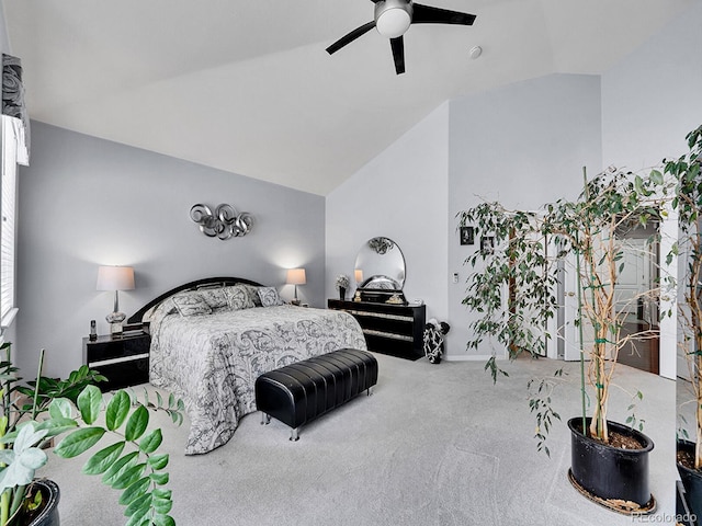 bedroom featuring carpet flooring, ceiling fan, and vaulted ceiling