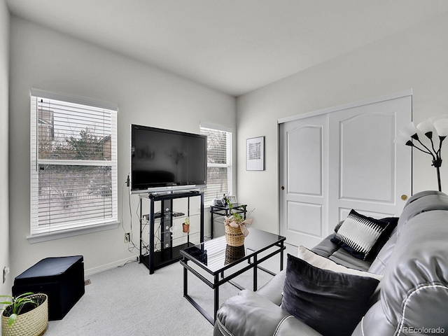 living room featuring light carpet