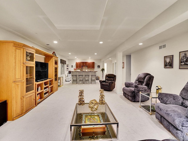 living room with light colored carpet