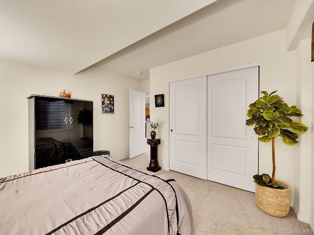 carpeted bedroom with a closet