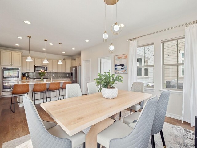 3056 Yale Dr, Broomfield, CO 80023 - dining space with wood finished floors and recessed lighting