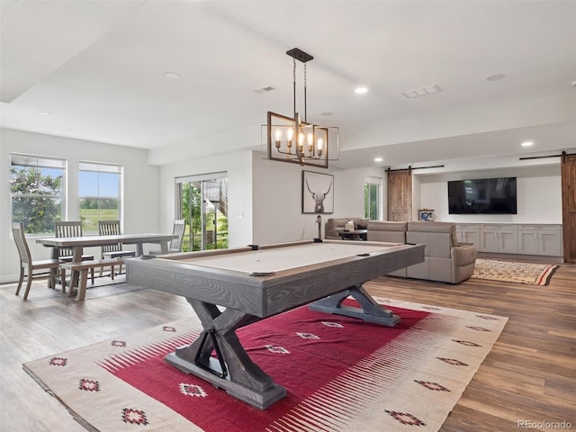 3056 Yale Dr, Broomfield, CO 80023 - recreation room featuring a barn door, wood finished floors, billiards, recessed lighting, and a chandelier