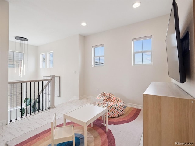 3056 Yale Dr, Broomfield, CO 80023 - sitting room with healthy amount of natural light, recessed lighting, and an upstairs landing