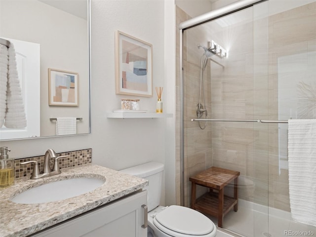 3056 Yale Dr, Broomfield, CO 80023 - full bath featuring vanity, a stall shower, and decorative backsplash