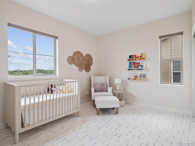 3056 Yale Dr, Broomfield, CO 80023 - bedroom featuring wood finished floors and a nursery area