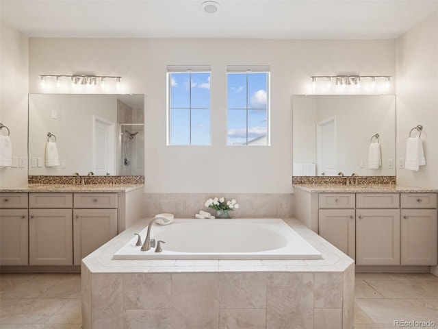 3056 Yale Dr, Broomfield, CO 80023 - full bath with tiled shower, a bath, two vanities, and tile patterned floors