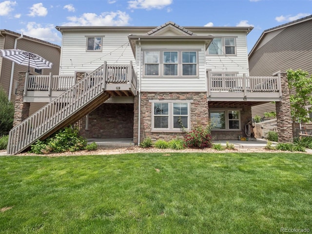 3056 Yale Dr, Broomfield, CO 80023 - back of house with stairs, a lawn, a patio area, and stone siding