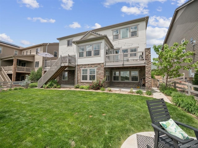 3056 Yale Dr, Broomfield, CO 80023 - back of house featuring stairs, a patio, and stone siding
