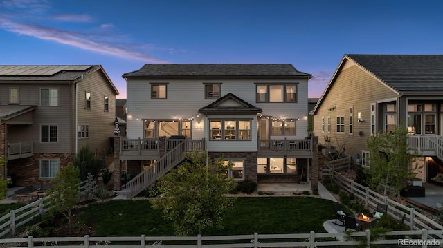 3056 Yale Dr, Broomfield, CO 80023 - back of property featuring stairway, a fenced backyard, and a patio area