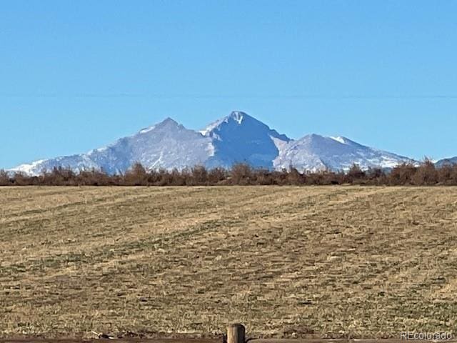 mountain view featuring a rural view