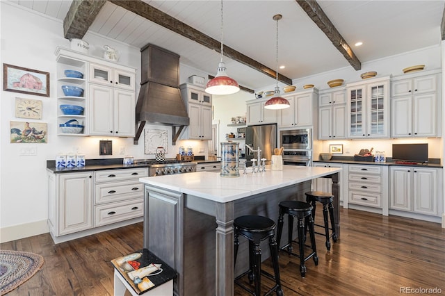 kitchen featuring custom exhaust hood, white cabinetry, appliances with stainless steel finishes, an island with sink, and dark stone counters