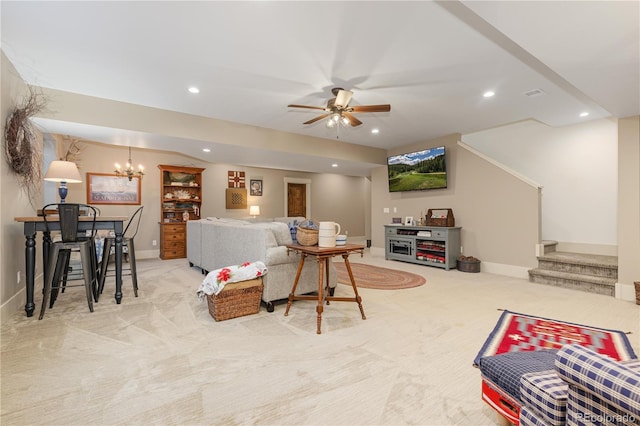 carpeted living room with ceiling fan