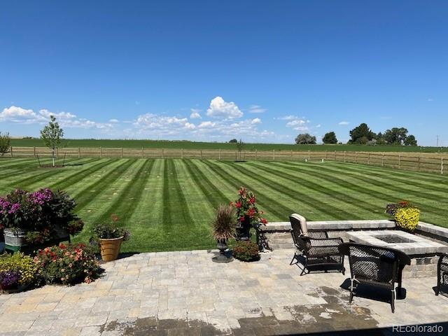 view of patio / terrace with a rural view