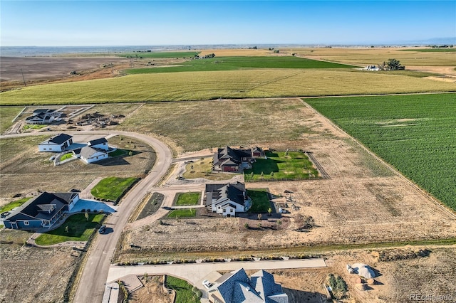 birds eye view of property with a rural view