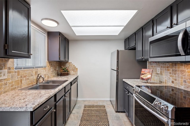1275 Soaring Eagle Dr, Colorado Springs, CO 80915 - kitchen featuring stainless steel appliances, tasteful backsplash, and light countertops