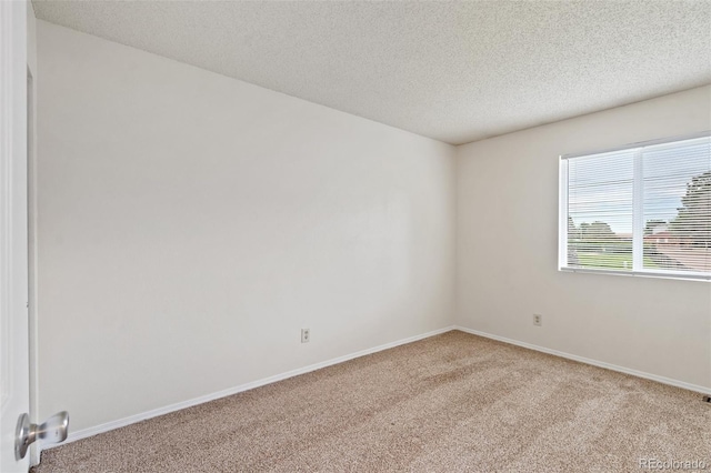 1275 Soaring Eagle Dr, Colorado Springs, CO 80915 - spare room with carpet flooring and a textured ceiling