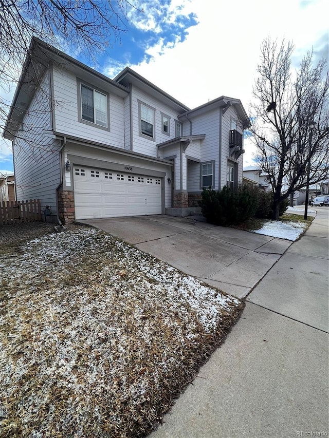 10638 Cherrybrook Cir, Highlands Ranch, CO 80126 - view of front facade featuring a garage, stone siding, and concrete driveway