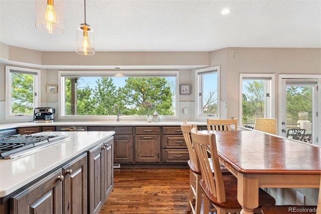 150 Chantrey Ct, Colorado Springs, CO 80906 - kitchen with dark wood-type flooring, light countertops, appliances with stainless steel finishes, and tasteful backsplash