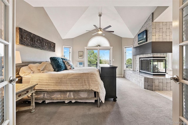 150 Chantrey Ct, Colorado Springs, CO 80906 - carpeted bedroom featuring a multi sided fireplace, access to outside, vaulted ceiling, and ceiling fan