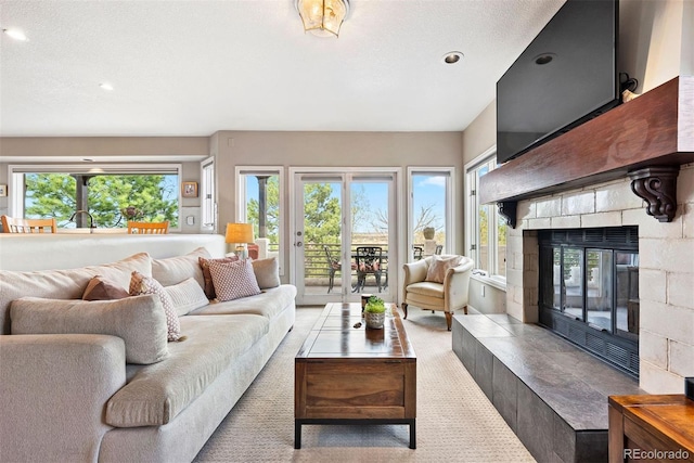 150 Chantrey Ct, Colorado Springs, CO 80906 - living room featuring recessed lighting, a glass covered fireplace, and light colored carpet