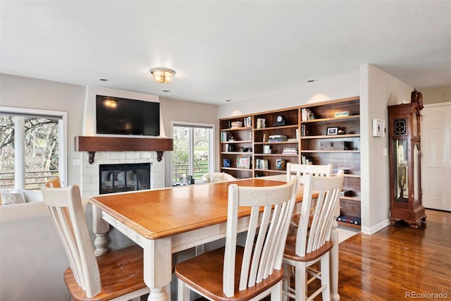 150 Chantrey Ct, Colorado Springs, CO 80906 - dining space featuring wood finished floors and a fireplace