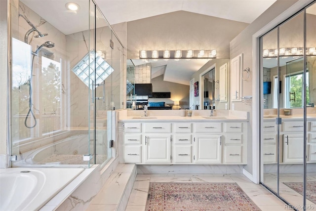 150 Chantrey Ct, Colorado Springs, CO 80906 - bathroom featuring a sink, vaulted ceiling, a stall shower, and marble finish floor