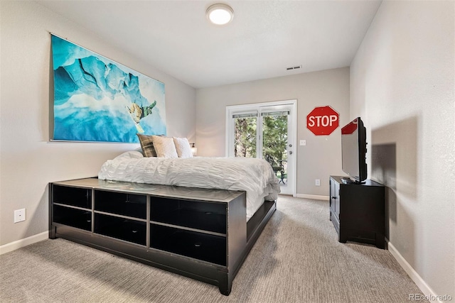 150 Chantrey Ct, Colorado Springs, CO 80906 - carpeted bedroom with visible vents, baseboards, and access to outside