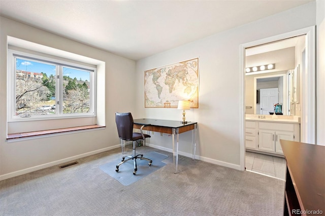 150 Chantrey Ct, Colorado Springs, CO 80906 - office featuring light colored carpet, a sink, baseboards, and visible vents