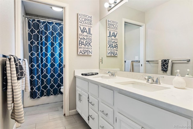 150 Chantrey Ct, Colorado Springs, CO 80906 - full bathroom featuring double vanity, a sink, and curtained shower