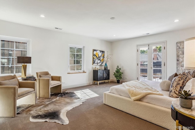 carpeted bedroom with access to exterior