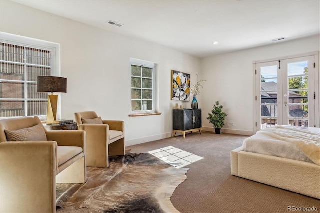 carpeted bedroom with access to outside and french doors