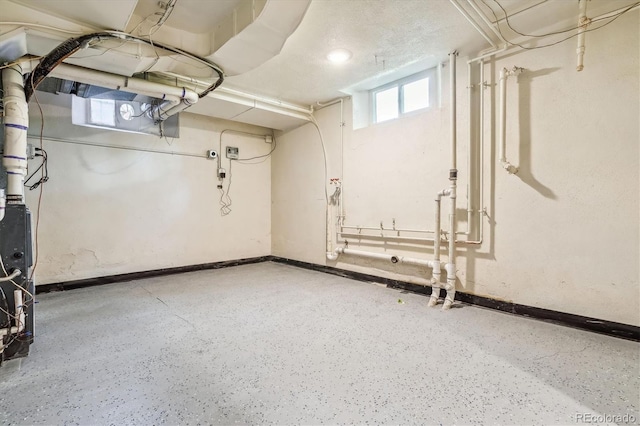 basement with a textured ceiling