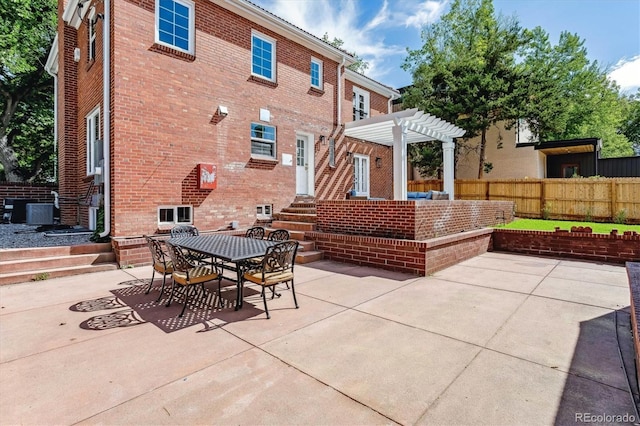 view of patio with a pergola and central AC unit