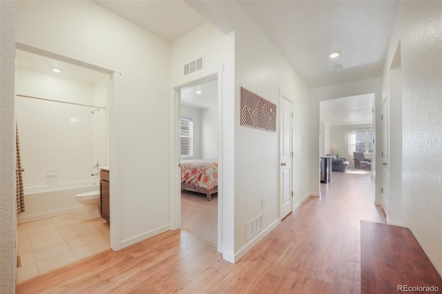 corridor featuring light hardwood / wood-style flooring