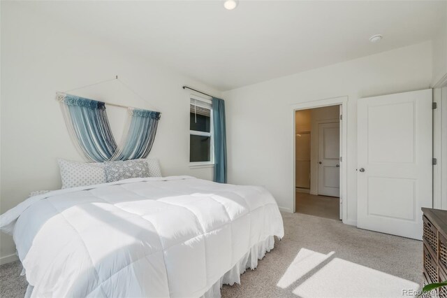 bedroom featuring light carpet