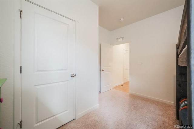 unfurnished bedroom with light carpet