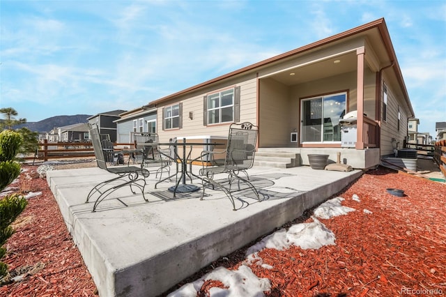 rear view of house with a patio